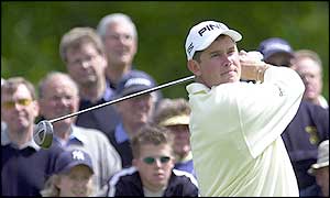 Lee Westwood tees off at the fourth