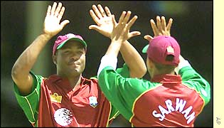 Brian Lara and Ramnaresh Sarwan celebrate another Indian wicket