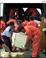 Fragments of the wreckage are unloaded