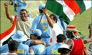 Fans celebrate a series win with the Indian players