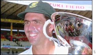 Cronje holding winners' trophy after test series in India, March 2000
