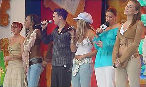 Performers at Centenary Square, Birmingham, lead the audience in singing God Save the Queen.