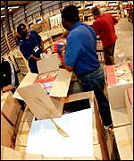 Staff at the Amazon.co.uk distribution centre in Milton Keynes prepare orders of Harry Potter 