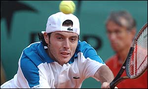 France's Sebastien Grosjean delivers a two-handed forehand