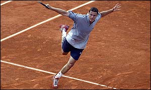 Russia's Marat Safin opens up his body to deliver a backhand against Arnaud Di Pasquale