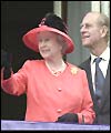 The Queen and Prince Philip wave to crowds from the balcony of Buckingham Palace
