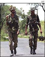 Indian soldiers patrol the border