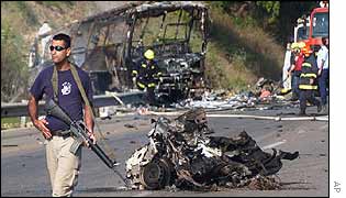 Israeli soldier surveys aftermath