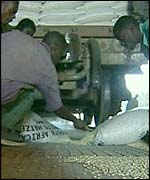 Sacks of grain being unloaded