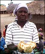 A woman holding Baobab fruits 