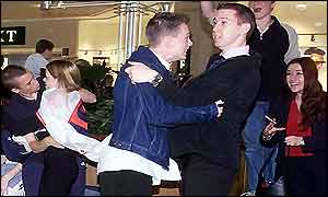 Fans watching the match outside a shop in Lakeside Shopping Centre react to the Beckham penalty