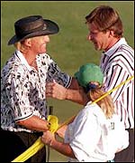 Nick Faldo (right) commiserates Greg Norman at Augusta in 1996