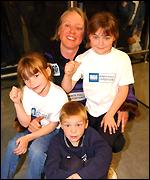 Ann Daniels with her three children at Heathrow