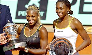 Serena and Venus Williams with their trophies