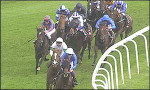 High Chaparral, ridden by Johny Murtagh, makes a late charge from third place