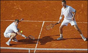 Paul Haarhuis and Yevgeny Kafelnikov in action in the men's doubles final.