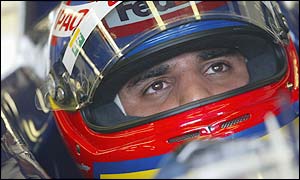 Williams driver Juan Pablo Montoya waits patiently in the pits