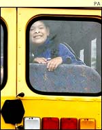 Child in school bus window