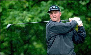 Darren Clarke hits the fairway on a difficult day for golf