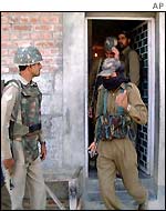 Policemen during a raid on Mr Geelani's house