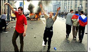 Rioters show their glee at the chaos