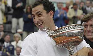 Costa is all smiles as he celebrates with the trophy 