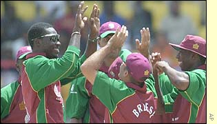 West Indies players celebrate the dismissal of Stephen Fleming
