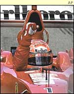 Michael Schumacher punches the air after winning the Canadian Grand Prix for the fifth time