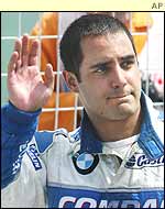 Juan Pablo Montoya marches back disconsolately to the pits