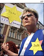 Demonstrator carries yellow Star of David