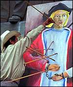 Arrows fired at picture of Columbus in Honduras