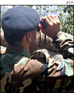 Pakistan Army officer watches Indian troop movements 