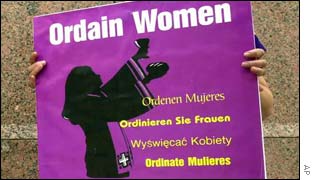 A protester calls for women priests