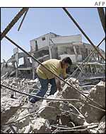 Palestinian man clears up in Arafat's compound