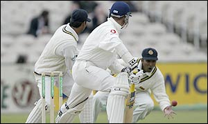 Jayawardene takes a sharp low catch to dismiss Trescothick just before tea