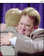 Victims Craig Martin (right) and David Clohessy hug