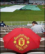 A fan with a Manchester United umbrella
