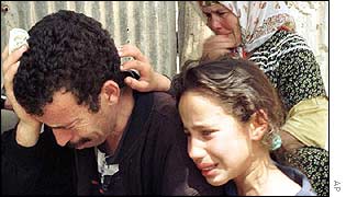 Relatives of people killed in an earlier massacre
