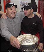 Scotty Bowman and Brett Hull celebrate in the locker room.
