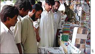 Pakistani newspapers with bombing details