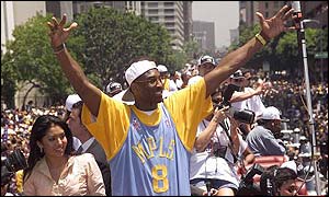 Kobe Bryant on board the Lakers' open-top bus in downtown LA.