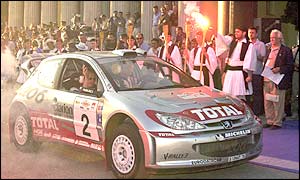 Finland's Marcus Gronholm and his co-driver Timo Rautiainen with their Peugeot 206 start of the 49th Acropolis Rally 