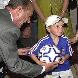 President Chirac with boy in French soccer kit