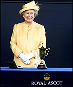 The Queen waits to present a trophy at Royal Ascot