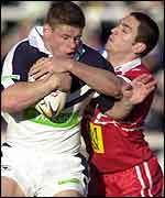 Lee Radford is tackled by the Yorkshire defence