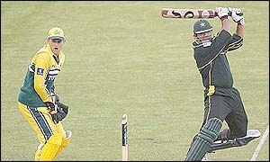 Darren Lehmann looks on as Inzamam ul-Haq hits an impressive ball