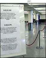 Sign warning of cancellations and empty queuing area, Heathrow Terminal 2