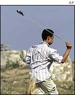 Palestinian boy with catapult