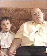 Adrian Phillips with his autistic son, James