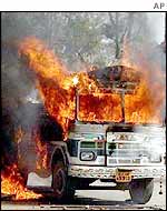 Truck set on fire by rioters in Ahmedabad